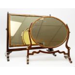 An Edwardian mahogany dressing table mirror, the oval mirror plate in swing frame, upon flared legs