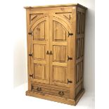 Waxed pine kitchen larder cupboard, two panelled arched doors, single drawer, plinth base, W109cm, H