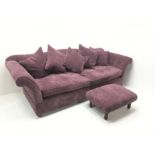 Grande four seat sofa upholstered in purple Harlequin fabric, scrolling arms, shaped back with scatt