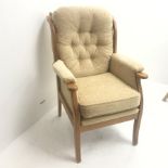 Beevers beech framed high seat armchair, upholstered in a seep buttoned beige fabric, W68cm