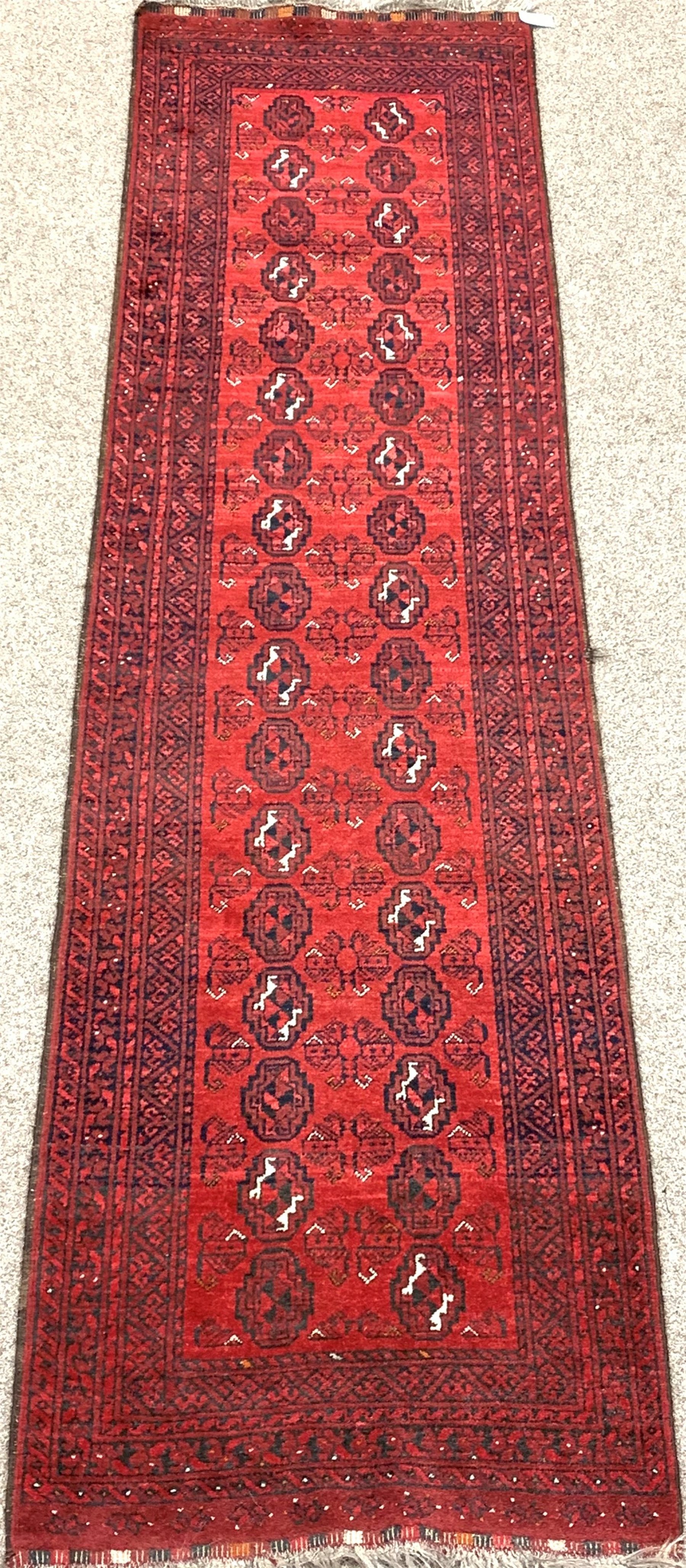 Persian Bokhara red ground runner, elephant foot pattern, 294cm x 76cm