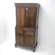 Reproduction Bevan Funnell mahogany serpentine front cocktail cabinet, two cupboards enclosing fitte