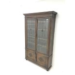 Early 20th century oak bookcase, two lead glazed doors enclosing four shelves above two cupboards, t