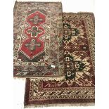 Turkish red ground rug, geometric design, the field decorated with three star motifs (198cm x 120cm)