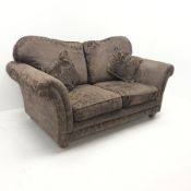 Two seat sofa upholstered in aubergine embossed fabric, turned supports, W190cm