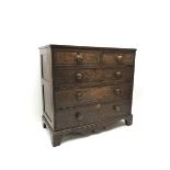 Early 19th century oak and mahogany banded chest, two short and three long drawers, shaped apron on