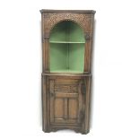 Jacobean style carved oak corner cabinet, open painted shelves above single cupboard, W75cm, H178cm