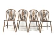 Set four oak wheel back dining chairs