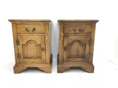 Pair traditional medium oak bedside/lamp cabinets, fitted with cupboard and drawer, W46cm, D43cm, H6