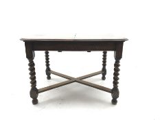 Early 20th century oak barley twist extending dining table with leaf, X shaped stretcher, curved end