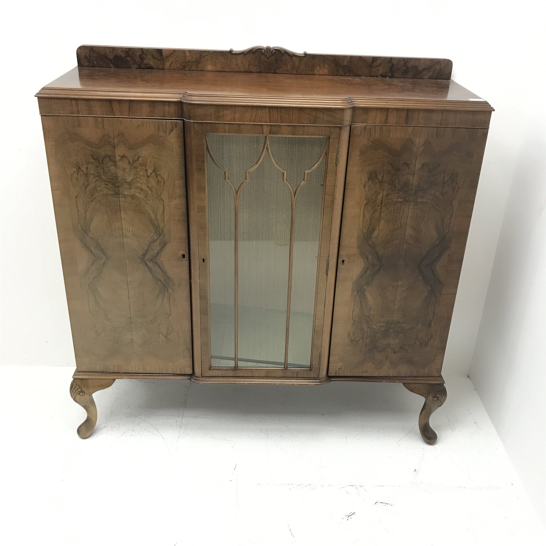 Early 20th century figured walnut side cabinet, shaped moulded top over central glazed door and two - Image 2 of 3