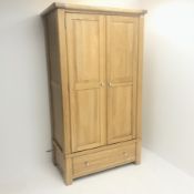 Solid oak wardrobe, two doors enclosing hanging rail above single drawer, stile supports, W111cm, H1