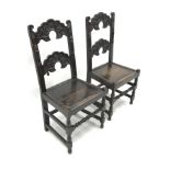 Pair 19th century Yorkshire/Derbyshire type oak hall chairs, detailed carved backs, solid seats, W50