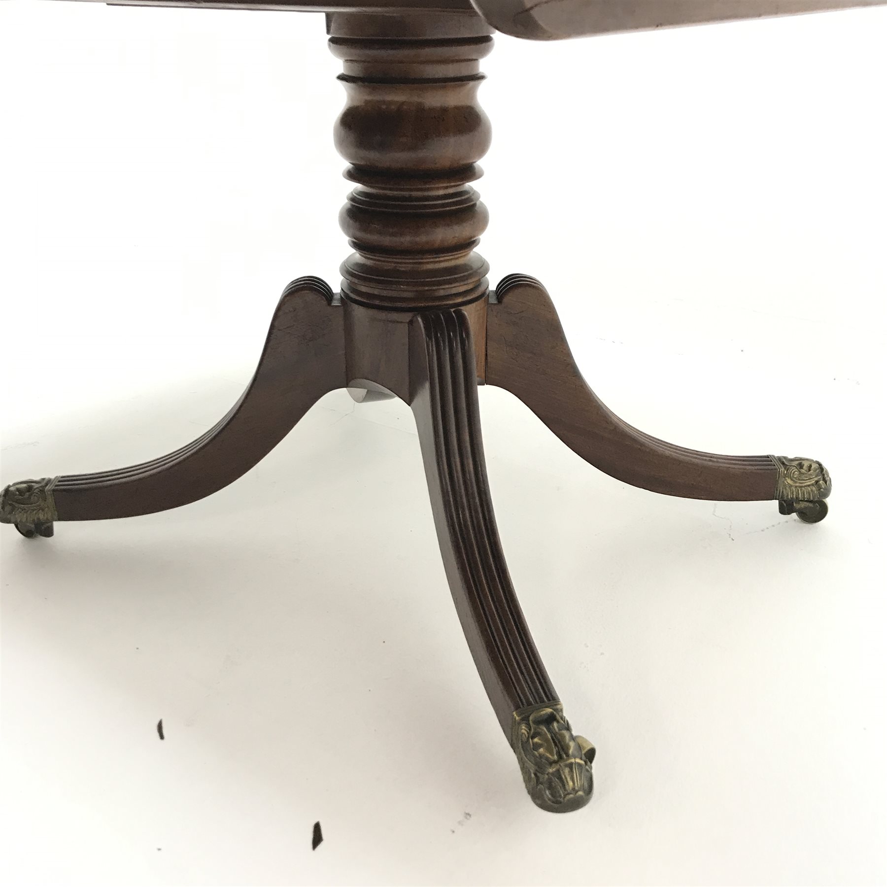 Regency mahogany tilt top table, single turned column on four shaped and reeded brass capped support - Image 4 of 5