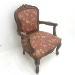 French style oak framed armchair, carved and shaped cresting rail, upholstered back, seat and arm, a