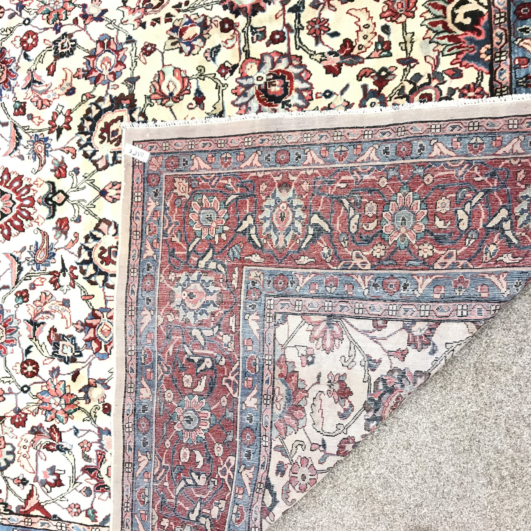 Persian Hamadan red and ivory ground rug, repeating border, central medallion in field of trailing f - Image 3 of 3