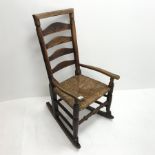 18th Century elm country ladderback rocker, rush seat, turned supports, W52cm