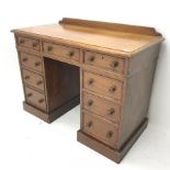 Victorian mahogany twin pedestal desk, moulded rectangular top with raised back, fitted with nine dr