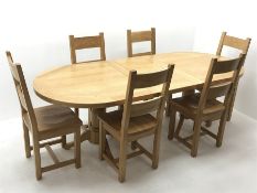 Oak dining table, oval extending top with foldout leaf, on twin turned pedestal base with shaped sup