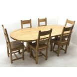 Oak dining table, oval extending top with foldout leaf, on twin turned pedestal base with shaped sup