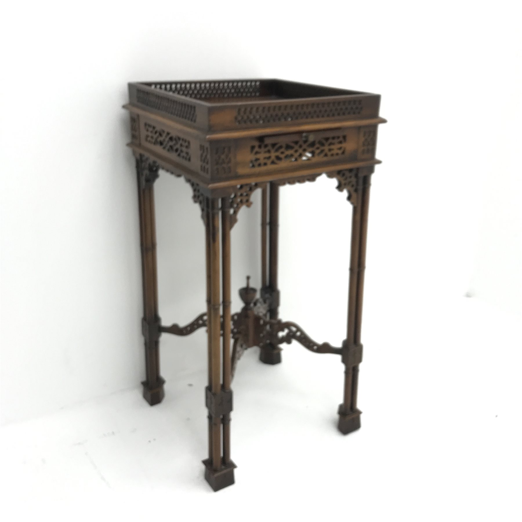 Chippendale style mahogany fretwork stand, single slide, turned supports joined by pierced stretcher