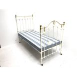 Victorian style cream metal and brass single bedstead with box base