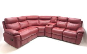 Large corner sofa upholstered in red leather, in built storage unit,