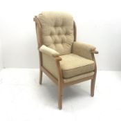 Beevers beech framed high seat armchair, upholstered in a seep buttoned beige fabric, W68cm