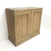 Early 20th century pine wine cabinet, two doors enclosing fitted sixty three bottle holder interior,