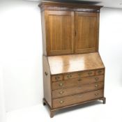 Georgian oak bureau bookcase, projecting cornice, two cupboards above fall front enclosing well fitt