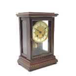 Late 19th century walnut cased mantle clock enclosed by bevelled glazed door and side panels, twin t