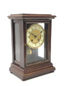 Late 19th century walnut cased mantle clock enclosed by bevelled glazed door and side panels, twin t