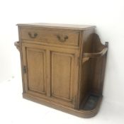 Early 20th century oak hallstand, single drawer above cupboard and stick stand, shaped plinth base,