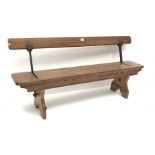 H Addison & Co Wellington Salop pitch pine and wrought metal reversible bench, W138cm