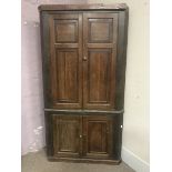 Large 18/19th century oak floor standing corner cupboard, four panelled doors, plinth base, W117cm,
