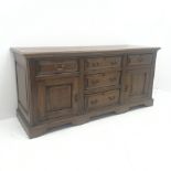 Late 18th century oak dresser, five drawers and two fielded panel cupboards, shaped plinth base, W18