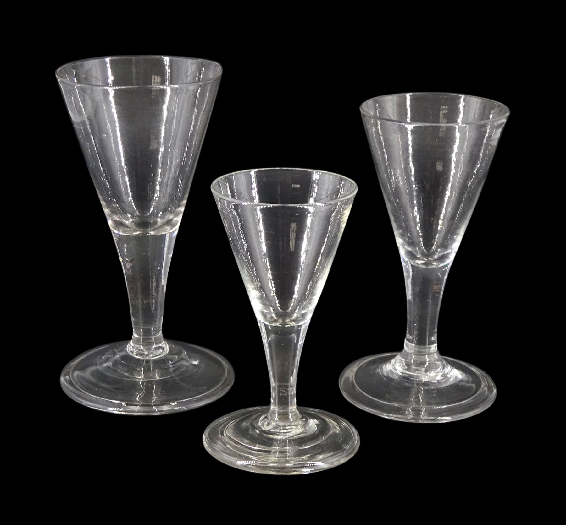 Three graduated 18th/19th century short ale glasses