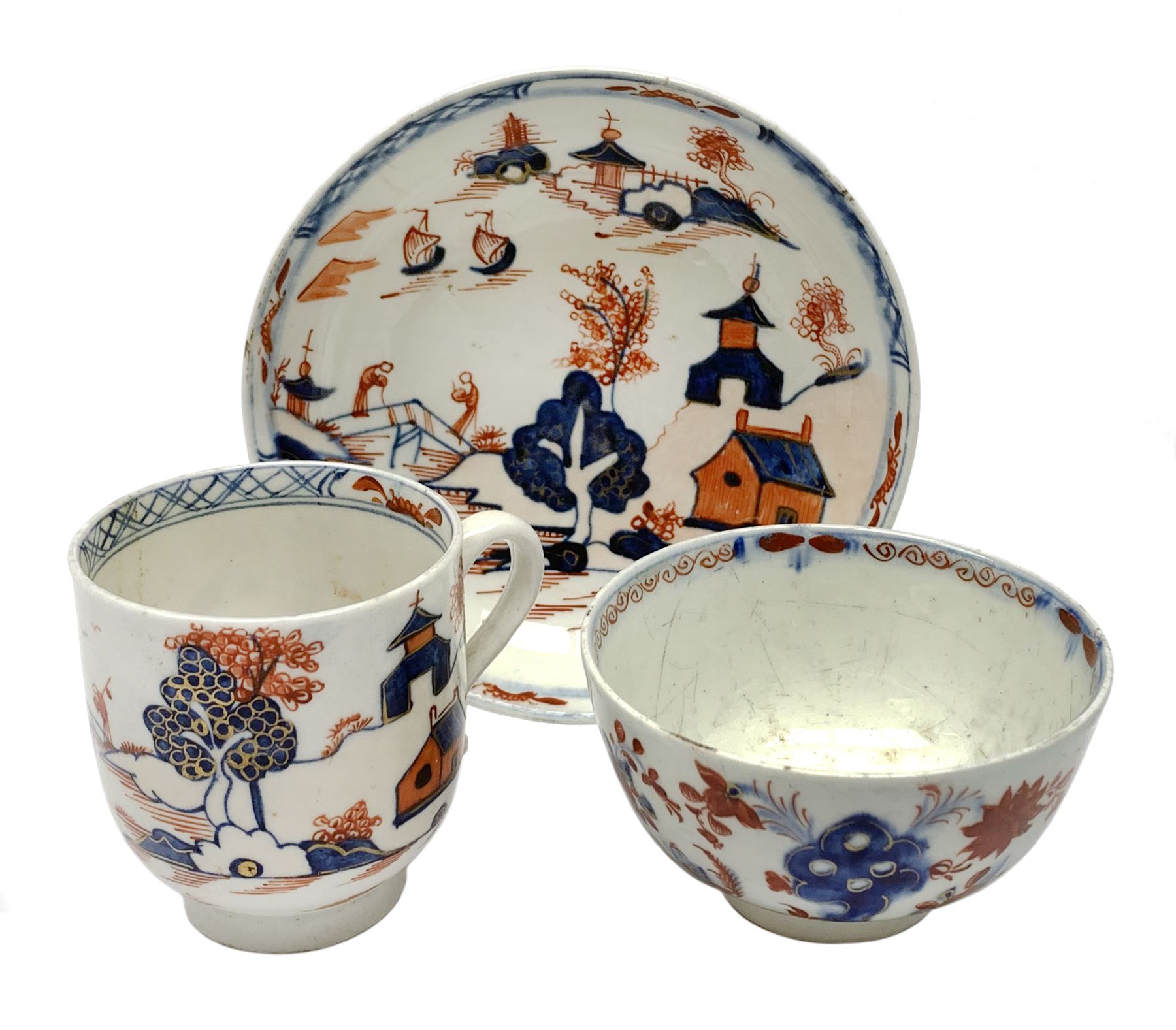Late 18th Century Lowestoft coffee cup and saucer, circa 1870, decorated in the Dolls House pattern,