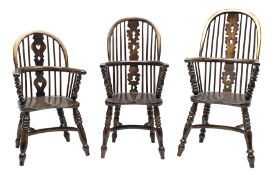 Matched set of three graduating miniature elm and beech Windsor armchairs