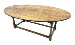 17th century style oval distressed light oak plank top dining table, rectangular stretcher base, L22