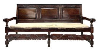 Early 18th century carved oak settle
