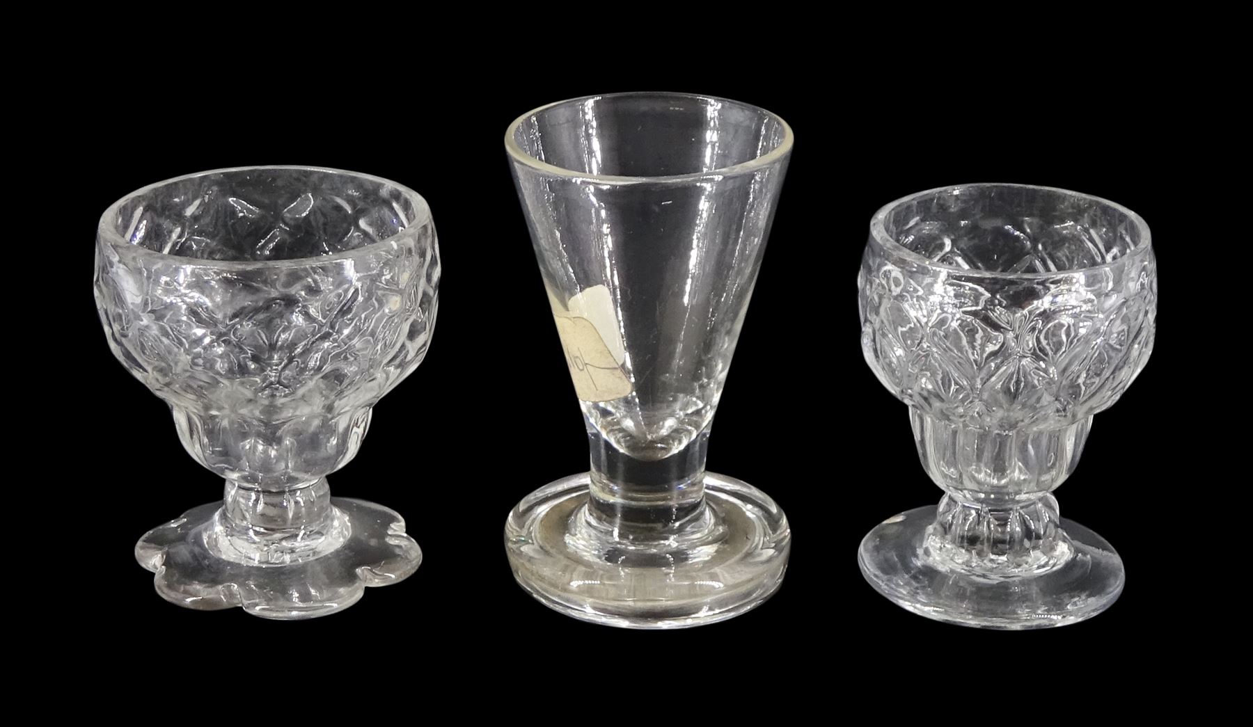 Two 18th century Bonnet or Monteith glasses, with honeycomb moulded bowls, one example with petal ed