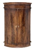 19th century bow front mahogany corner cupboard