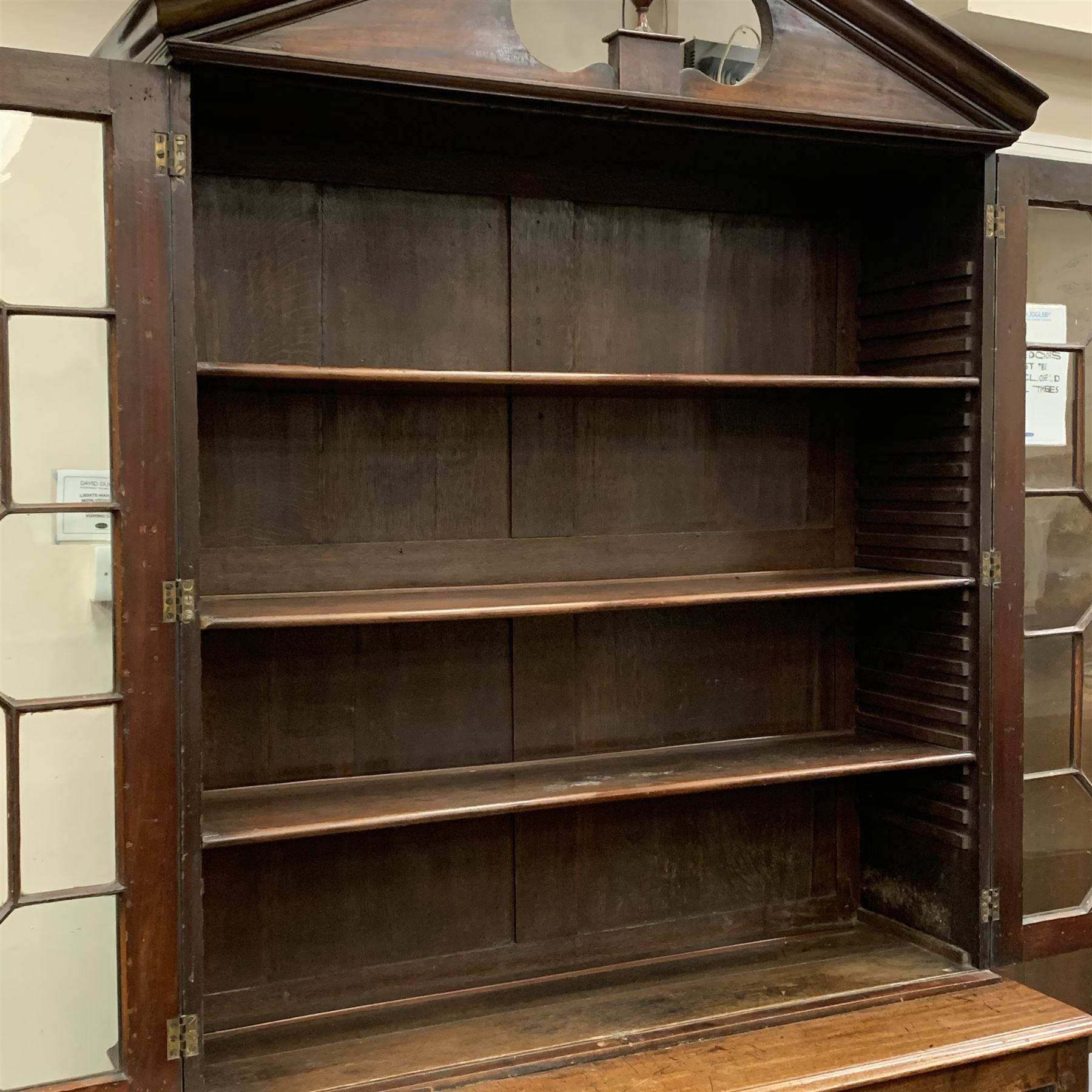 Georgian mahogany bookcase on press cupboard, moulded sloped arch pediment with central turned finia - Image 7 of 8