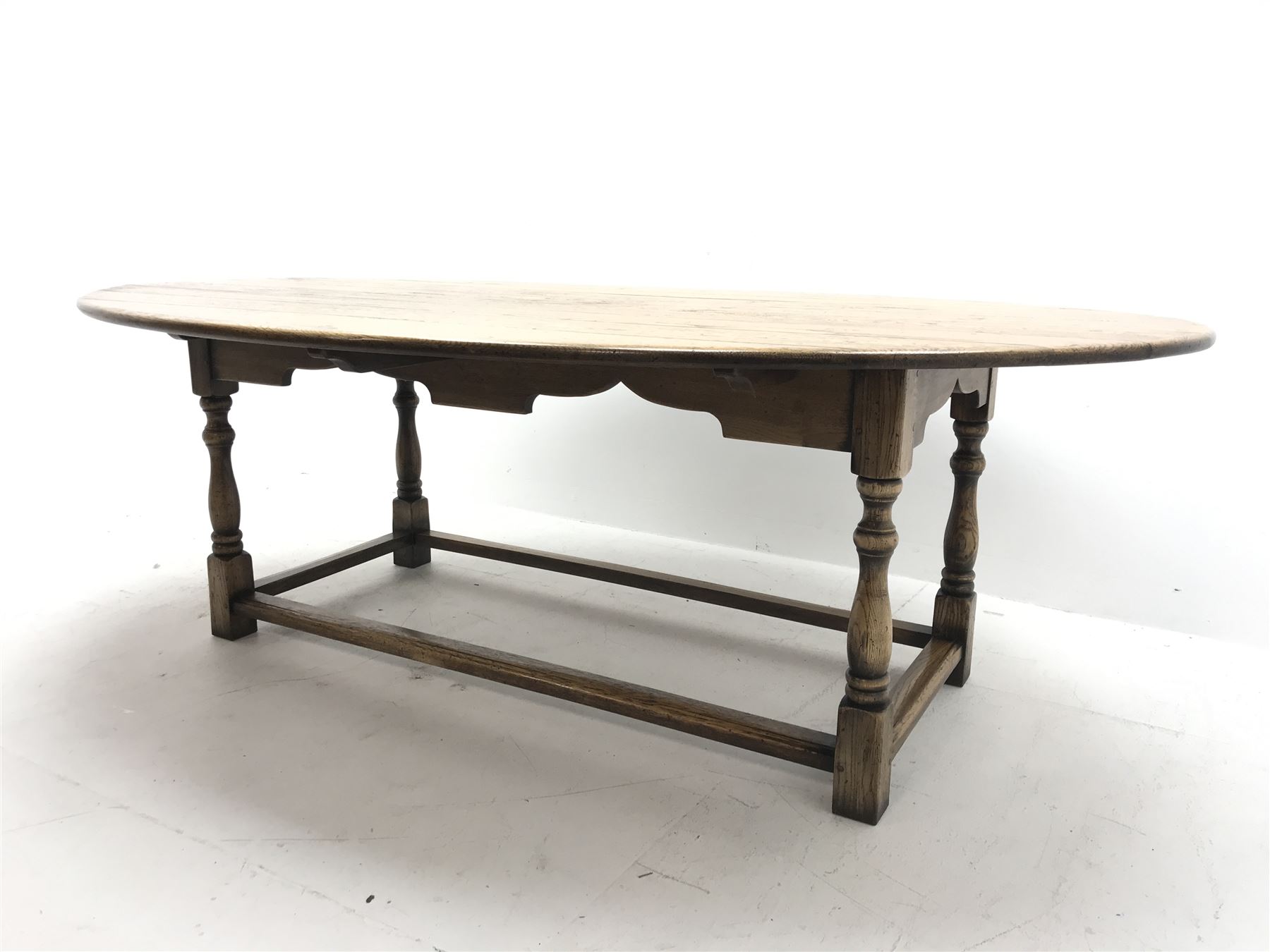 17th century style oval distressed light oak plank top dining table, rectangular stretcher base, L22 - Image 2 of 5