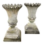 Large pair composite stone urns