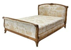 20th century French beech 5� Kingsize upholstered bedstead, ribbon and leaf carved cresting rail, wi