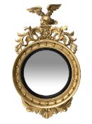 Large Regency carved wood and gesso circular convex mirror