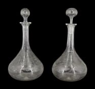 Two Edwardian shaft and globe decanters, the bodies engraved with panels of ferns and other foliage,