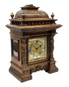Late 19th century walnut cased architectural mantel clock, caddy pediment carved with tile effect ra